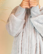 SAQUITOS FLEECE CON SALIDA PARA PIES